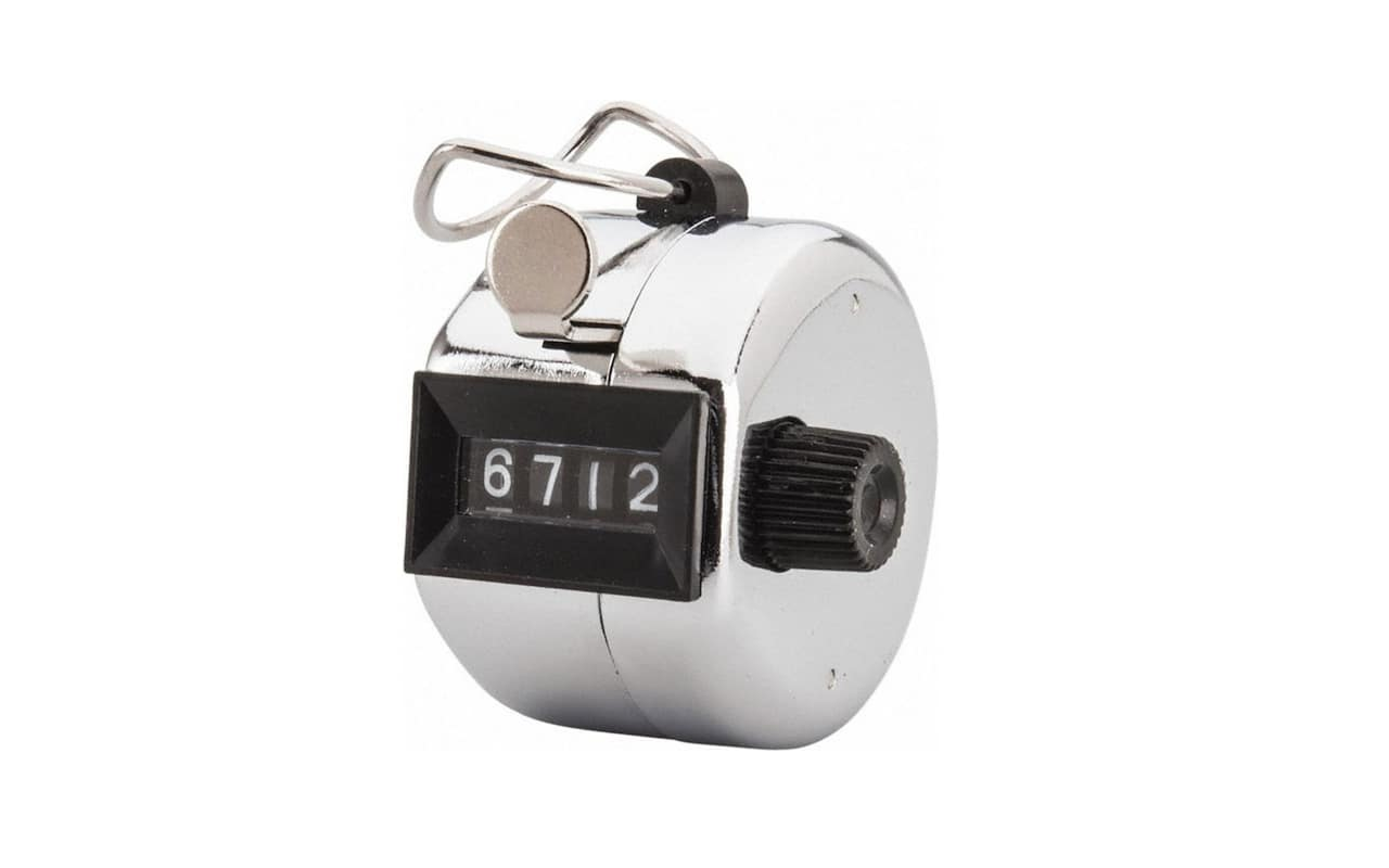 a silver, metal device with a four-digit number display and a single button